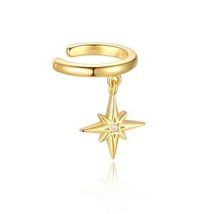 Detailed view of a gold 925 silver star ear cuff with a sparkling zircon tassel pendant