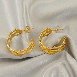 Golden C-shaped hollow earrings with three-layer intertwined lines and beaded details