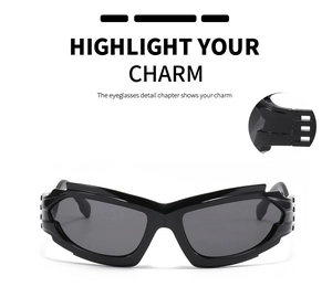 Detail view of stylish black oversized sunglasses with futuristic frame and hinge close-up