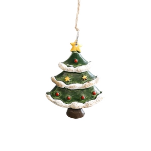 Miniature green resin Christmas tree ornament with snow edges and yellow star on white background
