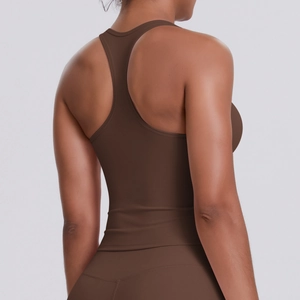 Detail of mocha racerback sports bra showing ergonomic seams and high-elastic fabric