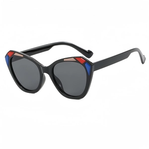 Fashionable oversized cat eye sunglasses with color block frame and dark grey lenses