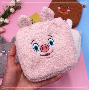 Detail of pink plush pig sanitary napkin pouch with soft lamb wool and embroidery