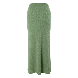 Detail of sage green textured fabric on a high-waisted bohemian style maxi skirt