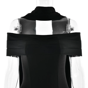 Detailed view of black strapless satin dress featuring a flowing neck scarf accent