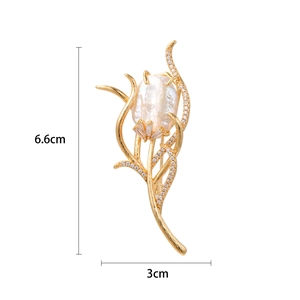 Elegant tulip brooch with gold plating, baroque pearl bud, and sparkling zircon stones