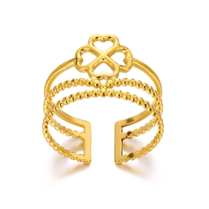 Detail of 18K gold stainless steel multi-layer ring featuring a clover charm and beaded bands