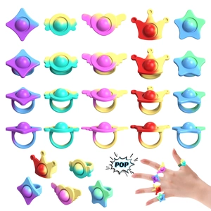 Close-up of rainbow silicone Pop It rings in butterfly, heart, and star shapes