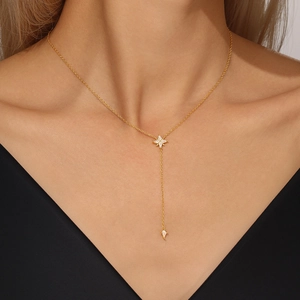 Close-up of a gold S925 sterling silver Y-shaped necklace with star pendants and zircon
