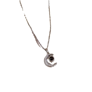 Silver stainless steel necklace with sparkling moon pendant and circular projection stone