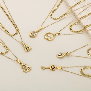 Elegant gold titanium steel heart and Eiffel Tower pendants with sparkling zircons