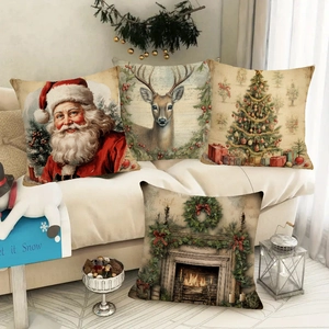 Set of four Christmas throw pillow covers with vintage reindeer and Santa designs on a sofa