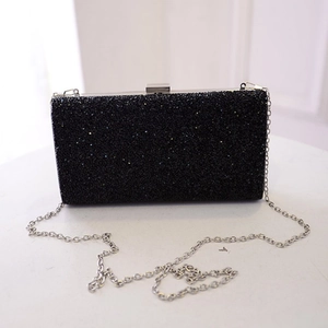 Elegant black glitter evening clutch bag with a silver chain strap for formal occasions