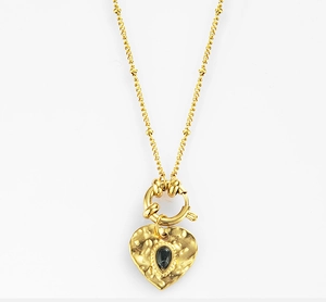 Detail of 18K gold-plated heart pendant with hammered texture and black teardrop stone