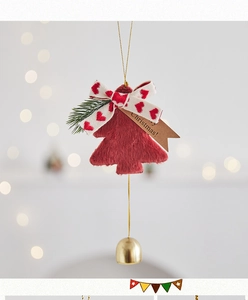 Detail of Christmas plush tree pendant with heart ribbon, pine needles and gold bell