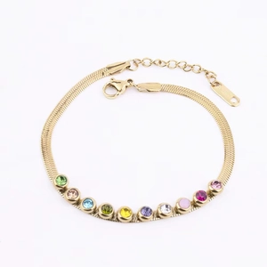 Detail of gold snake chain bracelet with eleven colorful round zircon gemstones and clasp