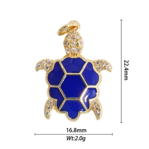 Detail of 18K gold turtle pendant with blue enamel and crystal inlay, 22.4mm size