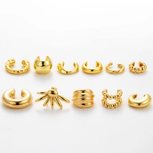11-piece set of gold plated ear cuffs featuring smooth, twisted, and sunburst designs