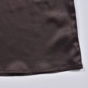 Detailed close-up of dark brown satin fabric texture and premium hem stitching quality