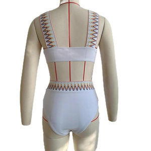 Rear view of white two-piece bikini featuring colorful bohemian embroidery on high-waist bottoms