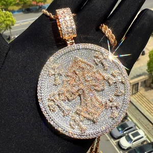 Macro view of rose gold shield pendant with cross pattern and shimmering cubic zirconia
