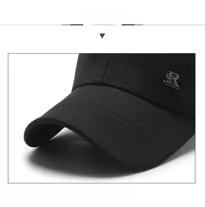 Close-up of black baseball cap showing twill fabric, stitching and SR metal logo
