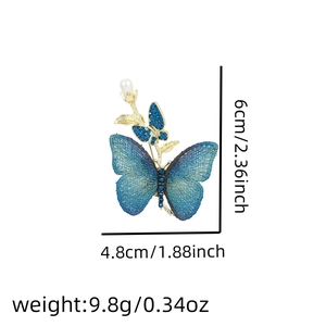Detail view of butterfly pearl brooch showing dimensions 6cm by 4.8cm and weight 9.8g