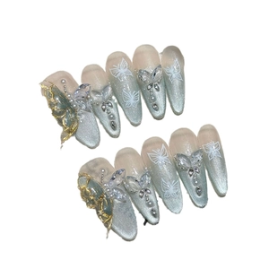 Handmade light blue cat-eye press-on nails with 3D butterflies and elegant pearls
