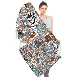 Detail view of microfiber beach towel featuring vibrant sun shine graffiti patterns