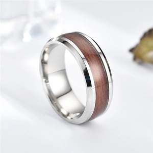 Polished stainless steel ring with dark wood inlay and bevelled edges at 45-degree angle