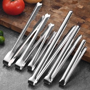SUS 304 stainless steel food tongs with serrated tips shown on a wooden cutting board