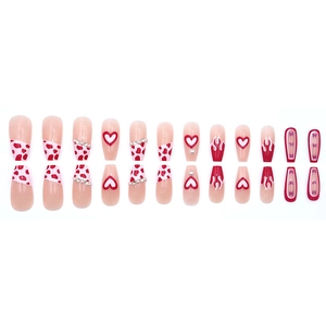 Long coffin press-on nails featuring red heart, cow print, flame, and butterfly designs