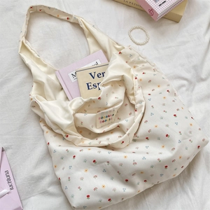 Detailed close-up of a floral tote bag interior showing the brand label and spacious storage
