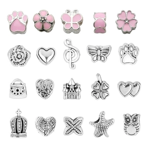 Macro view of 20 silver and pink alloy charms for DIY charm bracelets and jewelry
