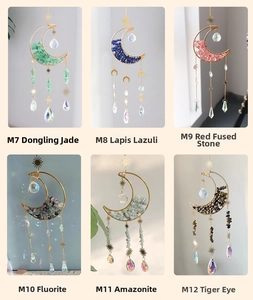Detail showing moon-shaped sun catchers with various natural crystals and golden metal accents