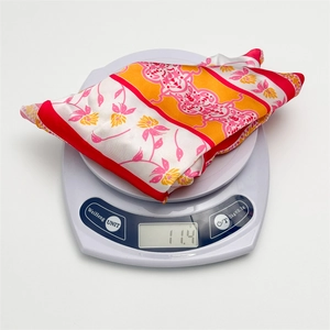 Digital scale showing the 11.4g lightweight floral satin headscarf for women