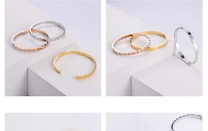 Detailed close-up of geometric segmented bangles in gold, silver, and rose gold finishes