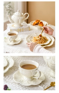 Close-up of white embossed ceramic teapot and cup with elegant European floral patterns