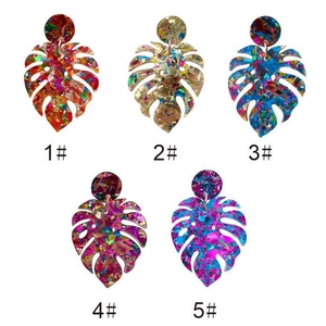 Exaggerated leaf-shaped acrylic earrings set with colorful glitter and gold foil accents