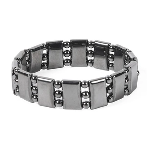 Detailed view of gray hematite magnetic bracelet with rectangular links and polished finish