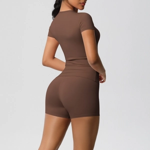 Detail of high-elasticity coffee brown yoga set featuring slim fit top and shorts
