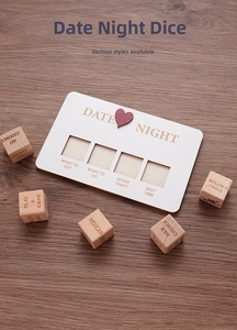 Macro view of wooden date night decision dice set with white base on dark wood table