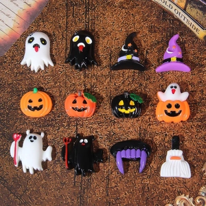 Set of 12 Halloween resin charms featuring ghosts, pumpkins and wizard hats on dark wood