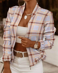 Detail of silver zipper and elastic cuffs on a plaid knit cardigan jacket for women