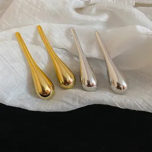 Minimalist teardrop dangle earrings in polished gold and silver metallic finish