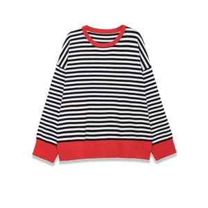 Relaxed fit black and white striped long sleeve tee with red ribbed trim on plain background
