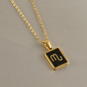 Detail of 18k gold plated stainless steel Scorpio constellation pendant on gold chain