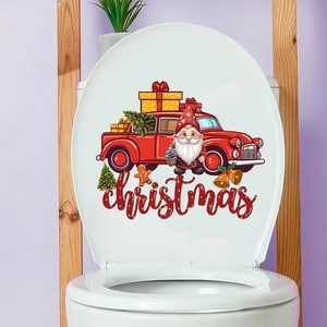Detail of Christmas truck and Santa stickers applied on a white toilet lid cover