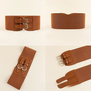 Detail view of caramel brown elastic wide belt with double golden pin buckles and texture