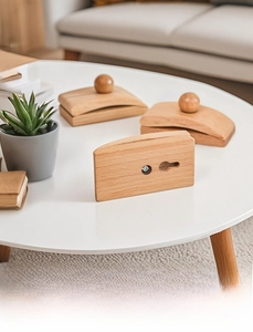Detail of wooden wall clips with smooth finish and metal mounting hardware for tapestries